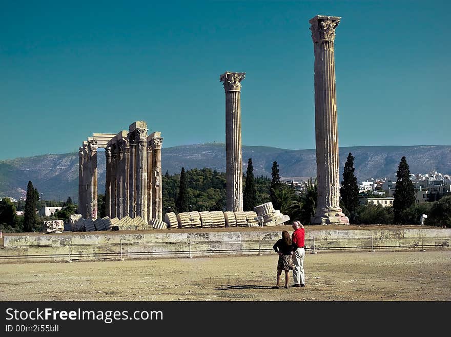 A pair of tourists at the Temple of Olympian Zeus in Athens, Greece