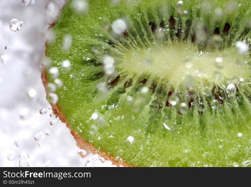 Close up of drops on the green fresh fruit