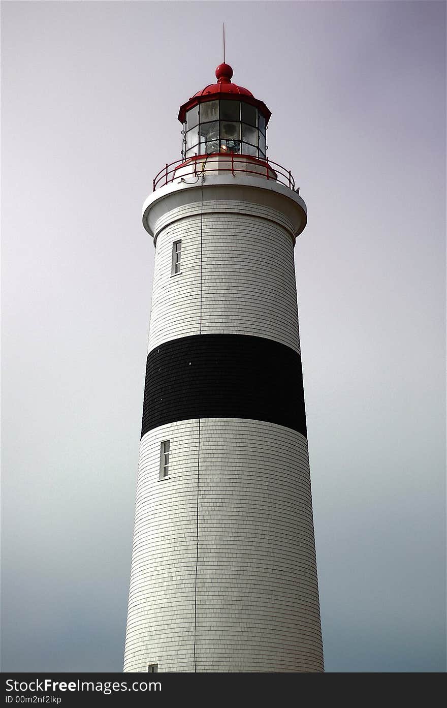 A lighthouse against a grey sky. A lighthouse against a grey sky