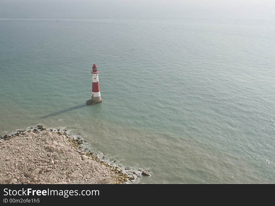 A view over a lighthouse in the south coast of England near Beachy-Head.  . A view over a lighthouse in the south coast of England near Beachy-Head.