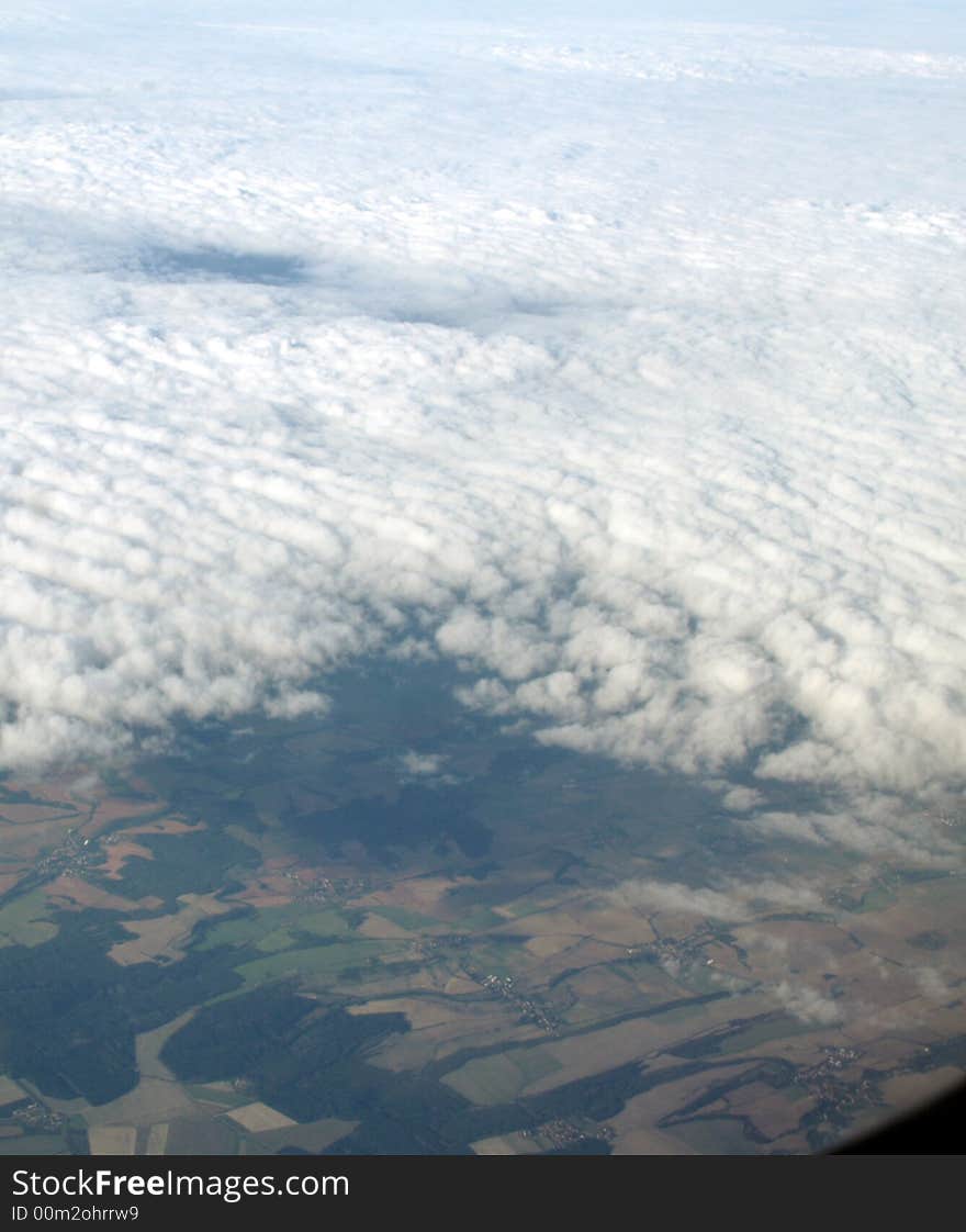 Clouds and earth, view in plane