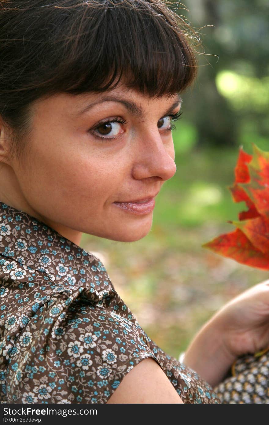 Beautiful woman walking in the autumn park. Beautiful woman walking in the autumn park