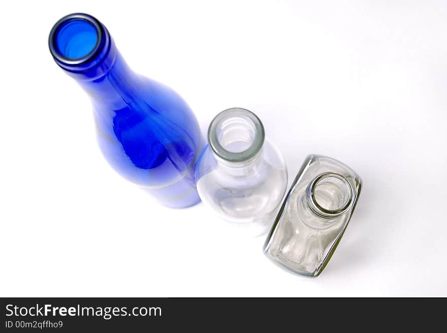 Three different bottles on a bel a background. Three different bottles on a bel a background