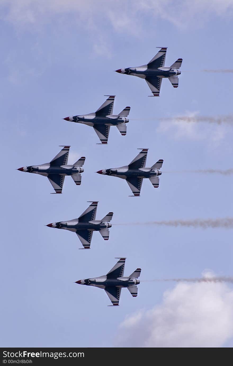 Six jets flying in formation during an air show. Six jets flying in formation during an air show.