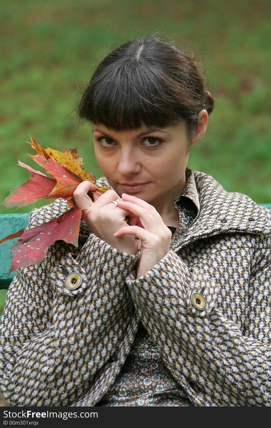 Beautiful woman walking in the autumn park. Beautiful woman walking in the autumn park