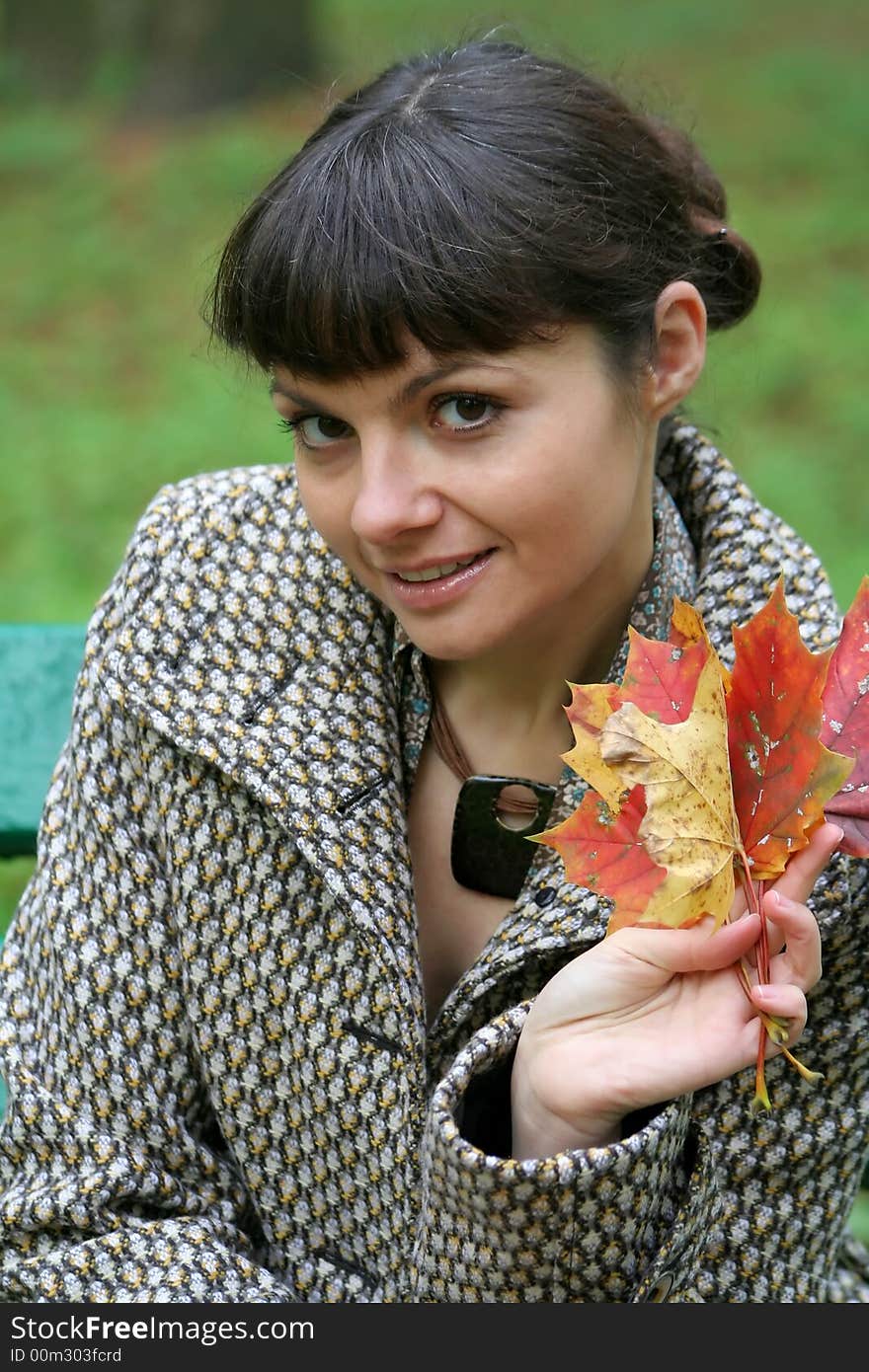 Beautiful woman walking in the autumn park. Beautiful woman walking in the autumn park