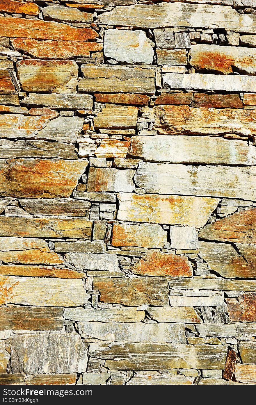 Detail of a colorful stone wall