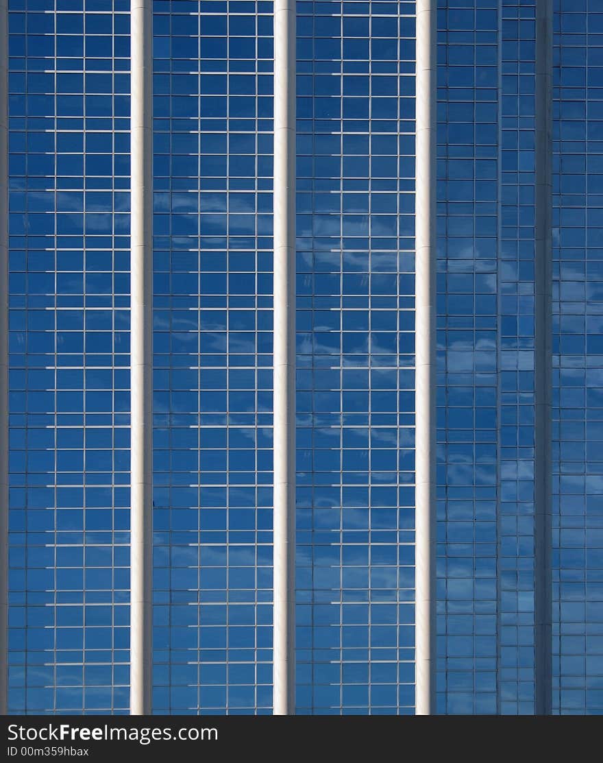 Clouds reflecting in the windows of a corporate building. Clouds reflecting in the windows of a corporate building