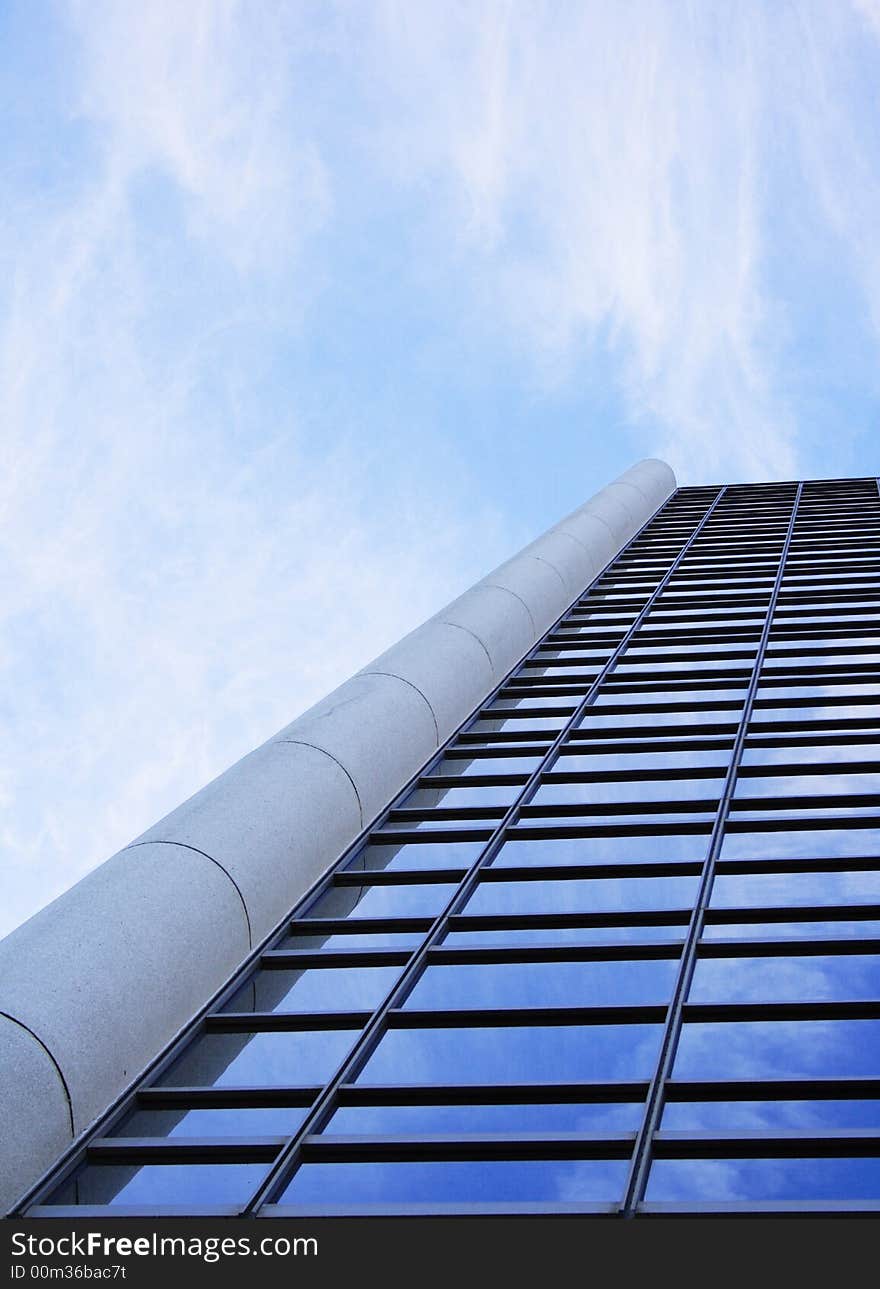 Clouds reflecting in the windows of a corporate building. Clouds reflecting in the windows of a corporate building