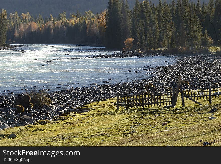 Meadow land infront of rocky river. Meadow land infront of rocky river