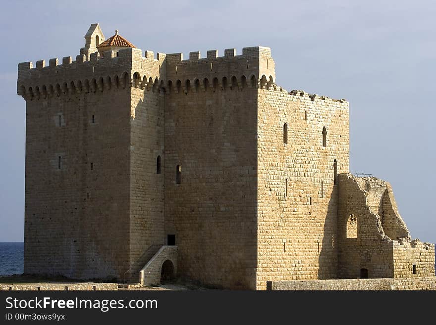 Large medieval fortress staying on the coast of the sea. Large medieval fortress staying on the coast of the sea