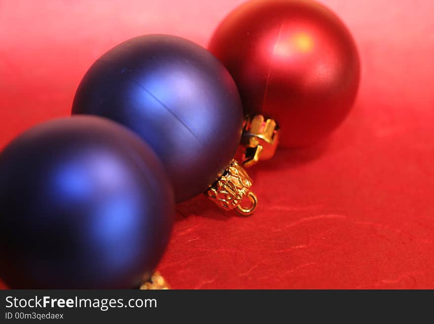 Three red and blue christmas baubles ,christmas decoration. Three red and blue christmas baubles ,christmas decoration