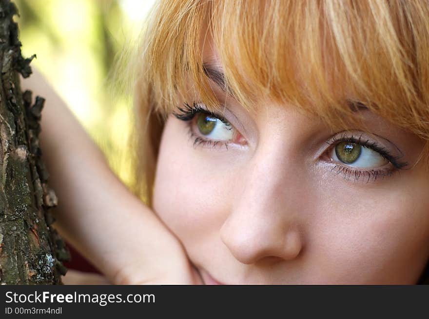 Wistful cute blond girl in the autumn park. Wistful cute blond girl in the autumn park