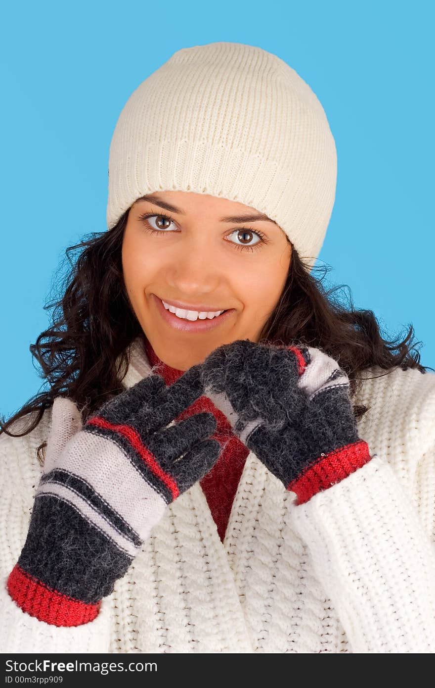 Happy winter girl in white isolated on blue background