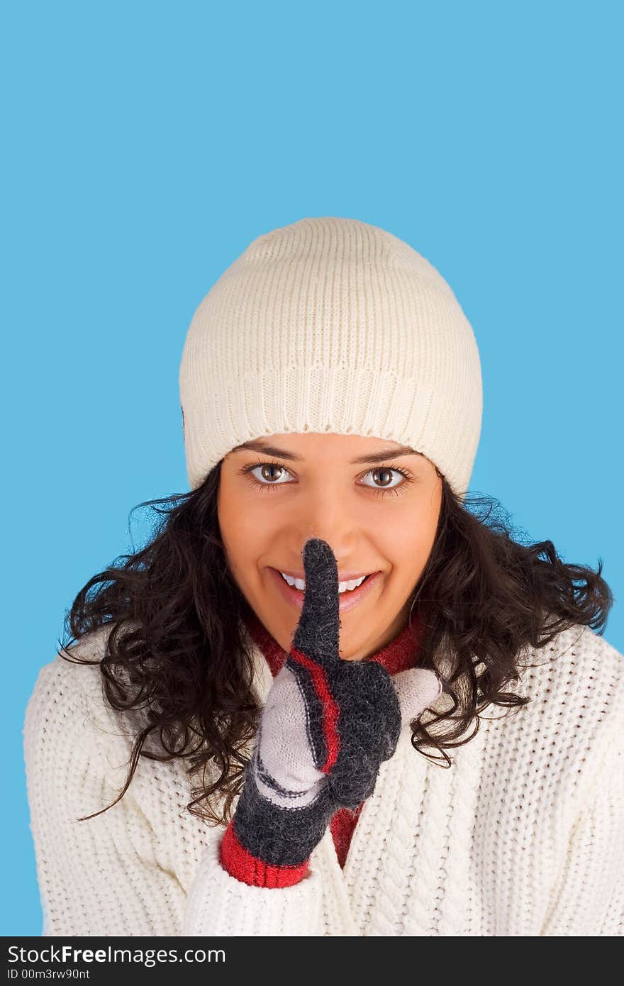 Happy winter girl in white isolated on blue background