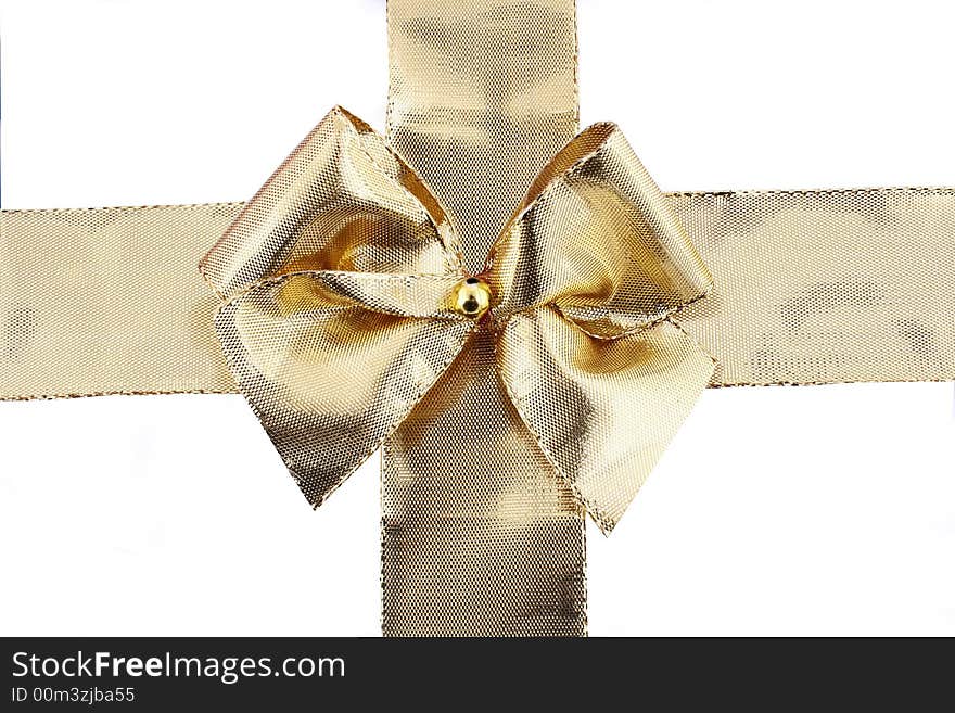 Gift golden ribbon and bow isolated on white.