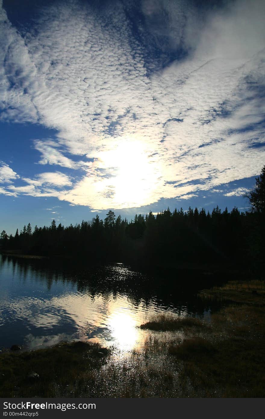 Reflective tarn in an autumn forest. Reflective tarn in an autumn forest