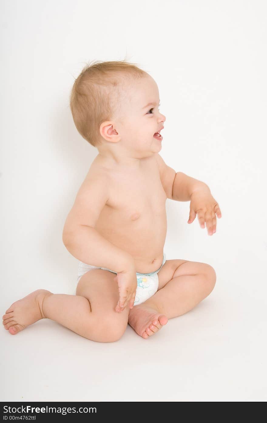 Smiling baby girl, toddler, isolated on the white background