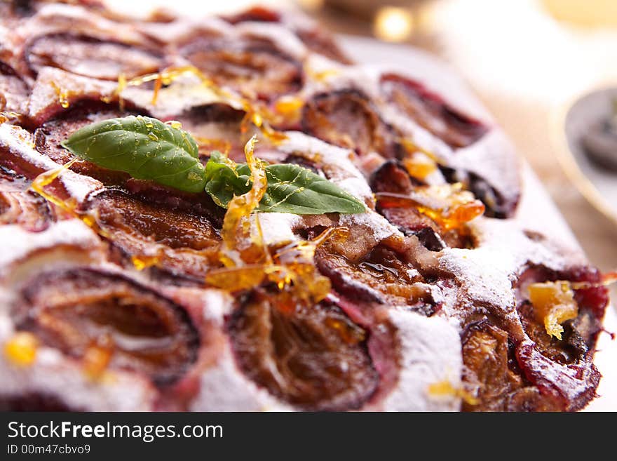 Fresh delicious plum cake close-up