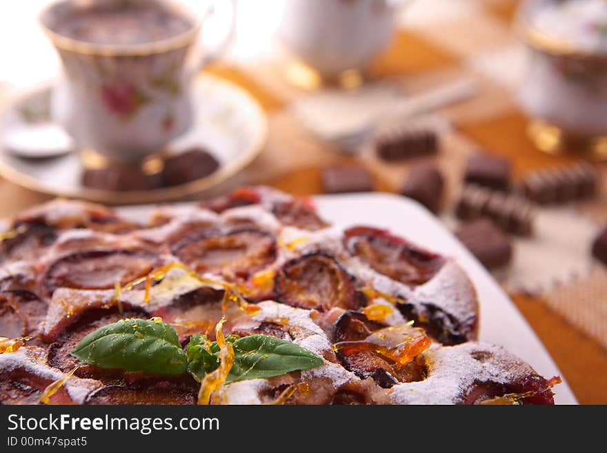 Fresh delicious plum cake close-up