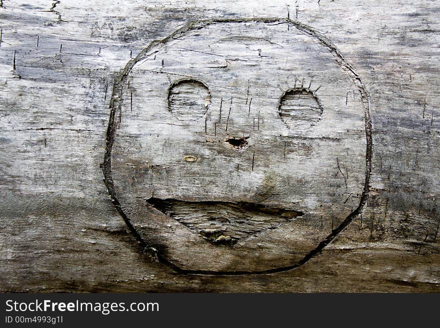 Smile graven in wood