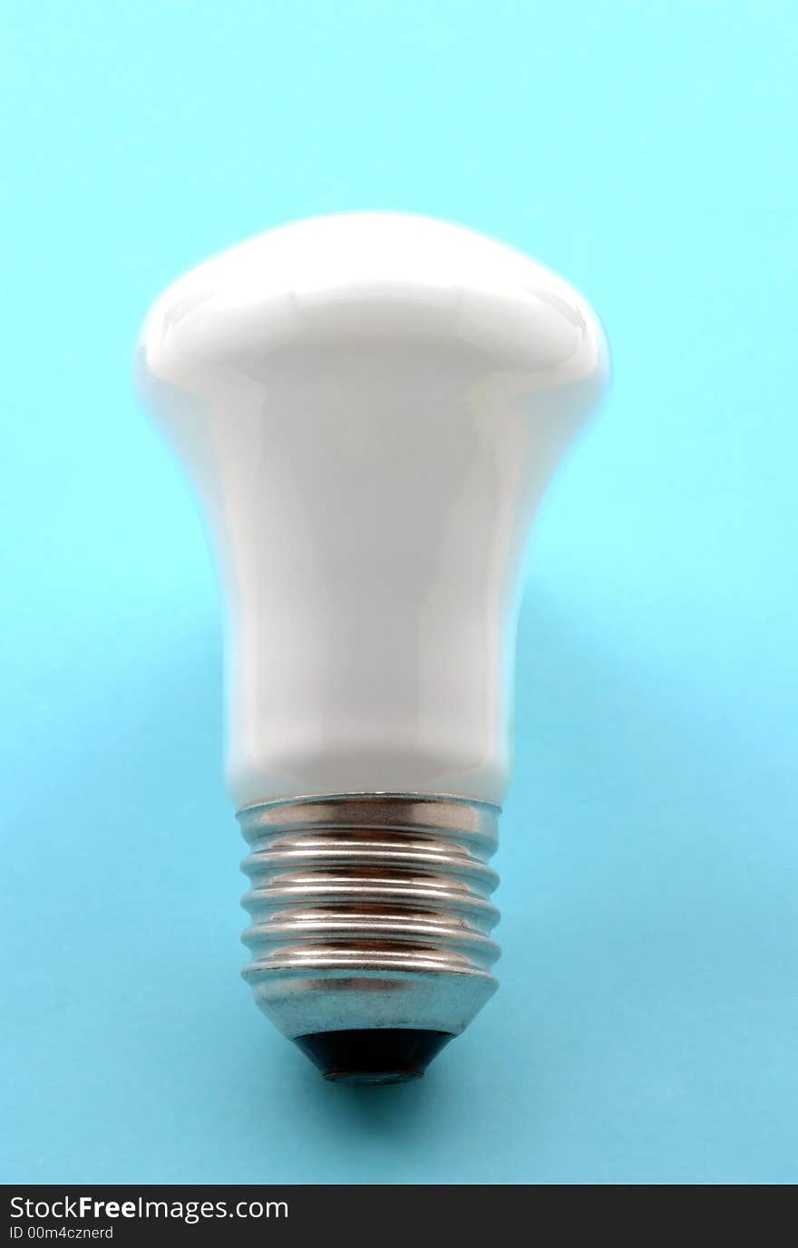 Light Bulb On Blue Background