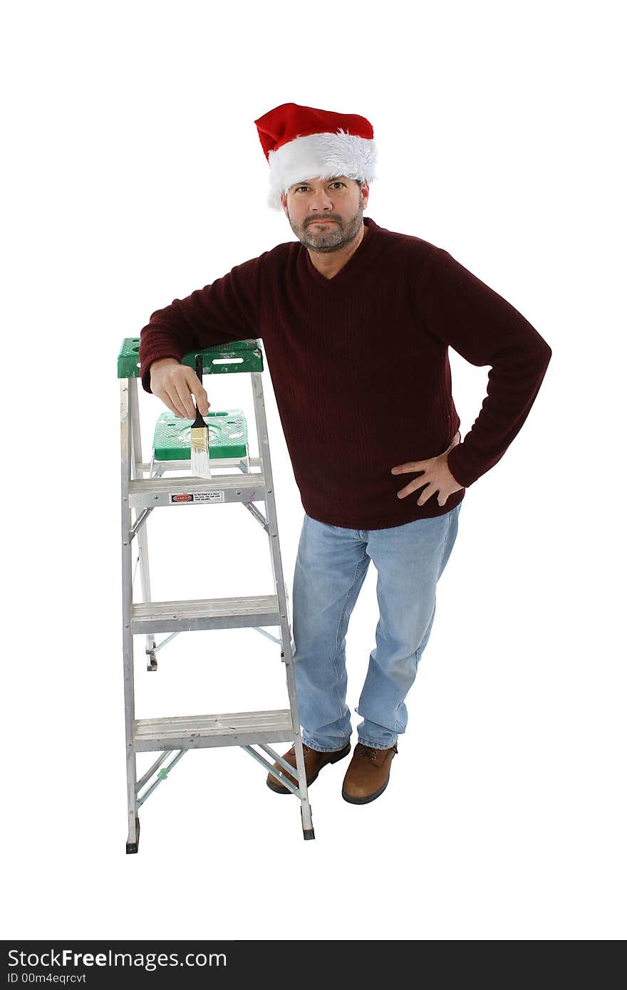 Man in santa hat leaning on ladder with white paint brush. Man in santa hat leaning on ladder with white paint brush