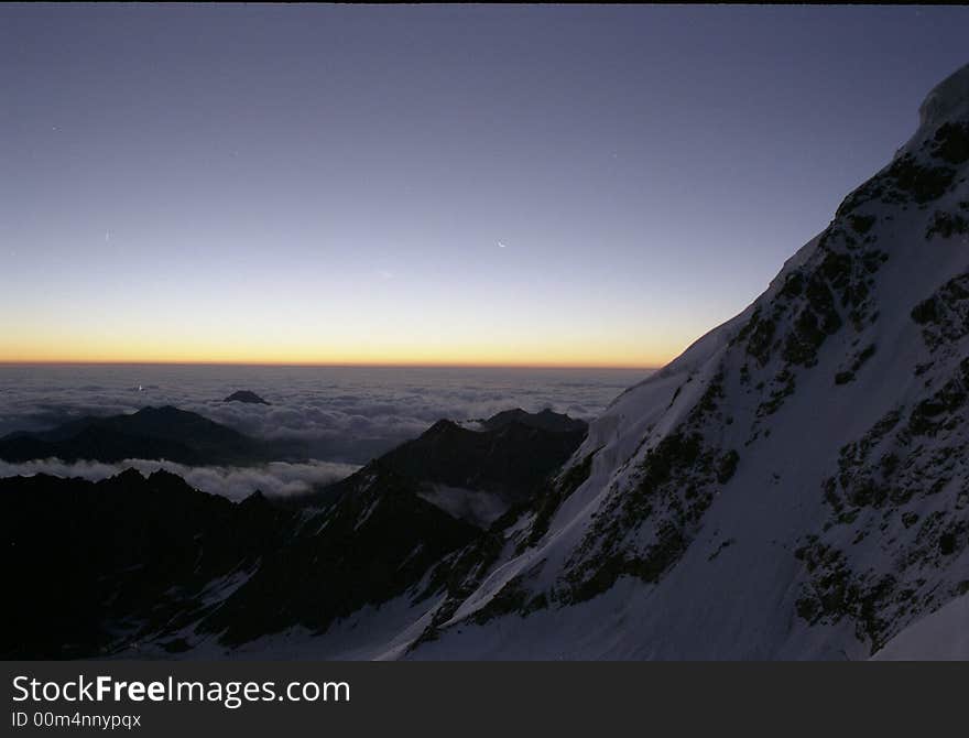 Black mountain, clouds and sunrise. Black mountain, clouds and sunrise