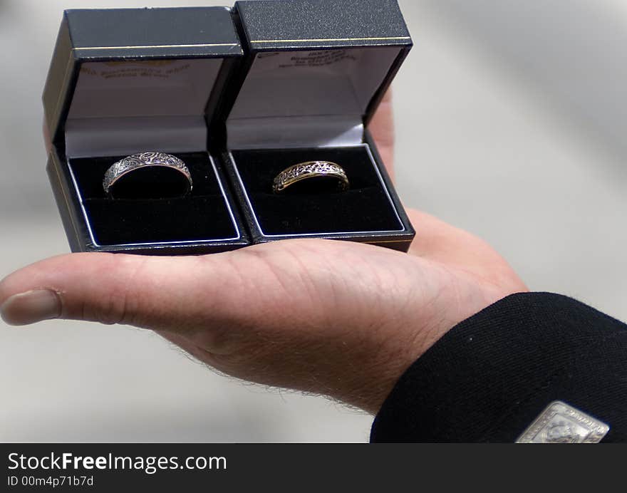 An image of two celtic wedding rings being held by the best man