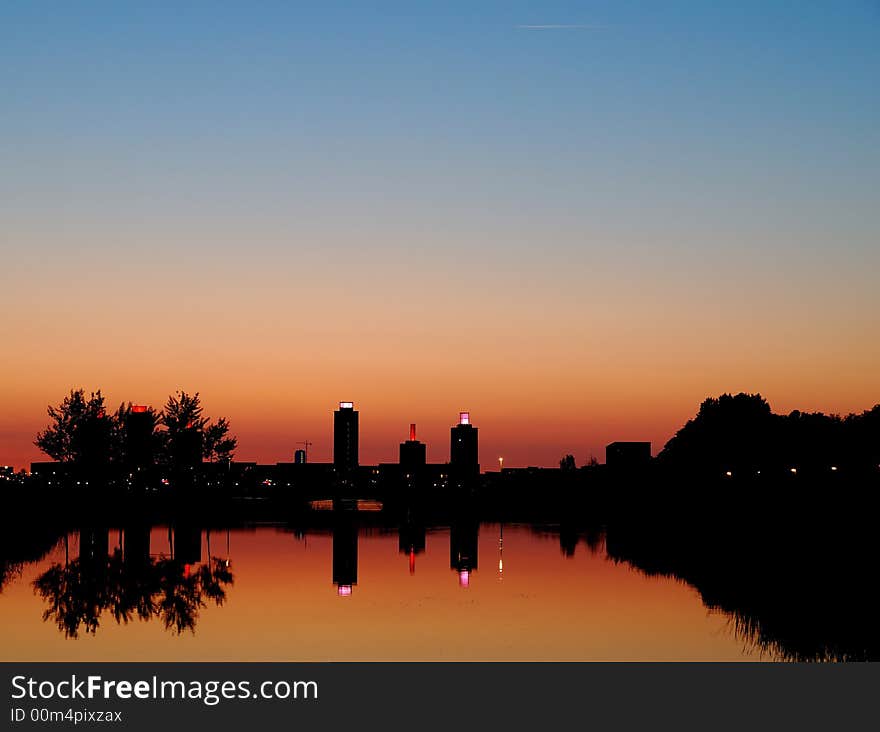 A moment after sunset skyline of Ypenburg with reflection in water. A moment after sunset skyline of Ypenburg with reflection in water.