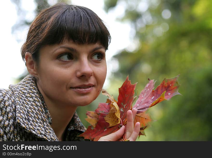 Beautiful woman walking in the autumn park. Beautiful woman walking in the autumn park