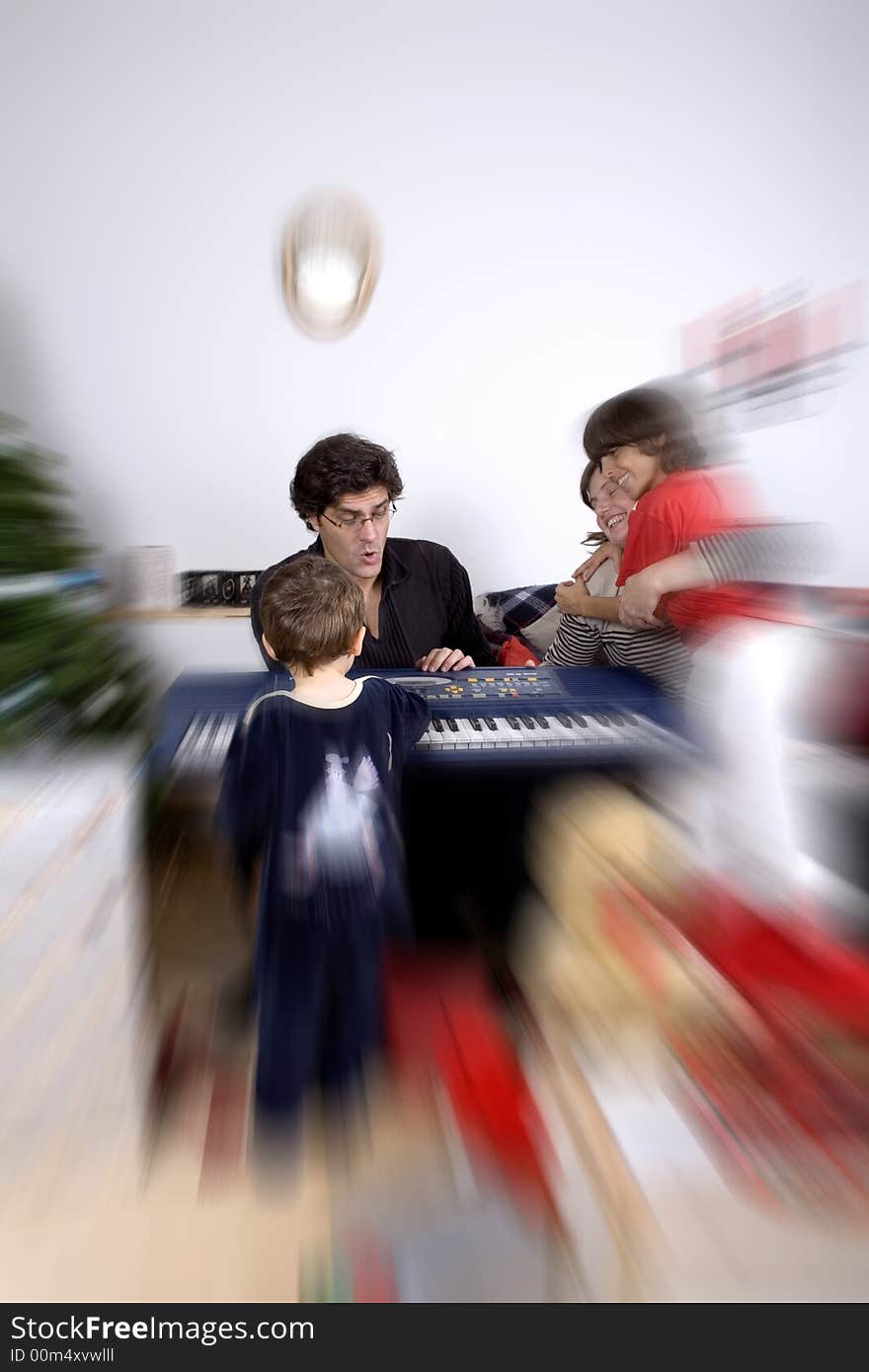 Happy family having fun and opening gift at christmas time. Happy family having fun and opening gift at christmas time