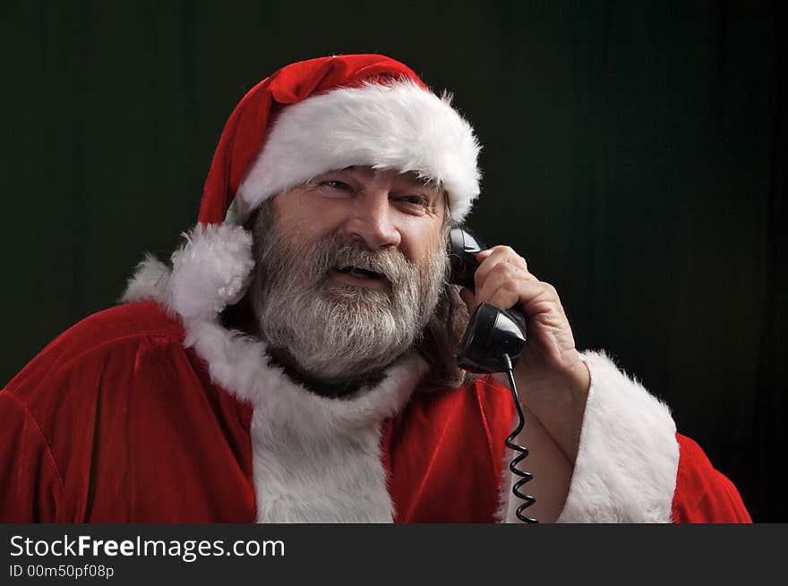 A young Santa with gray hair and beard having a good time