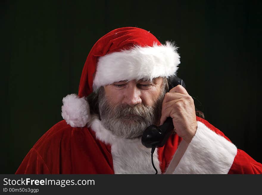 A young Santa with gray hair and beard having a good time