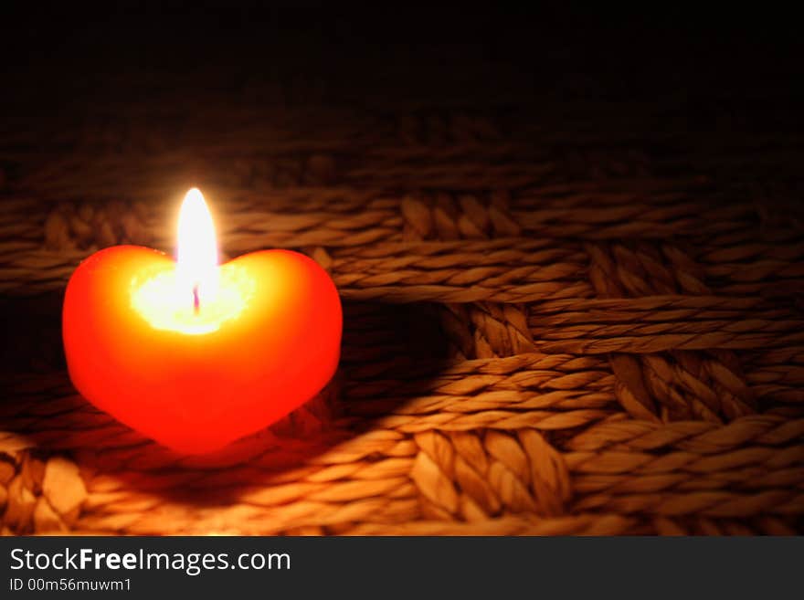 On  a photo candle in form heart