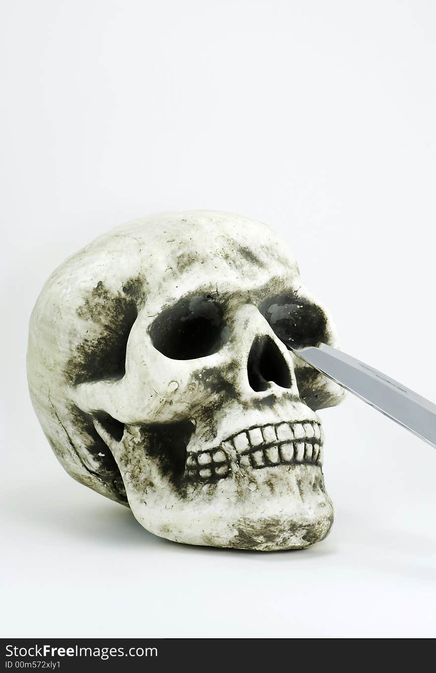 Skull With A Knife Blade