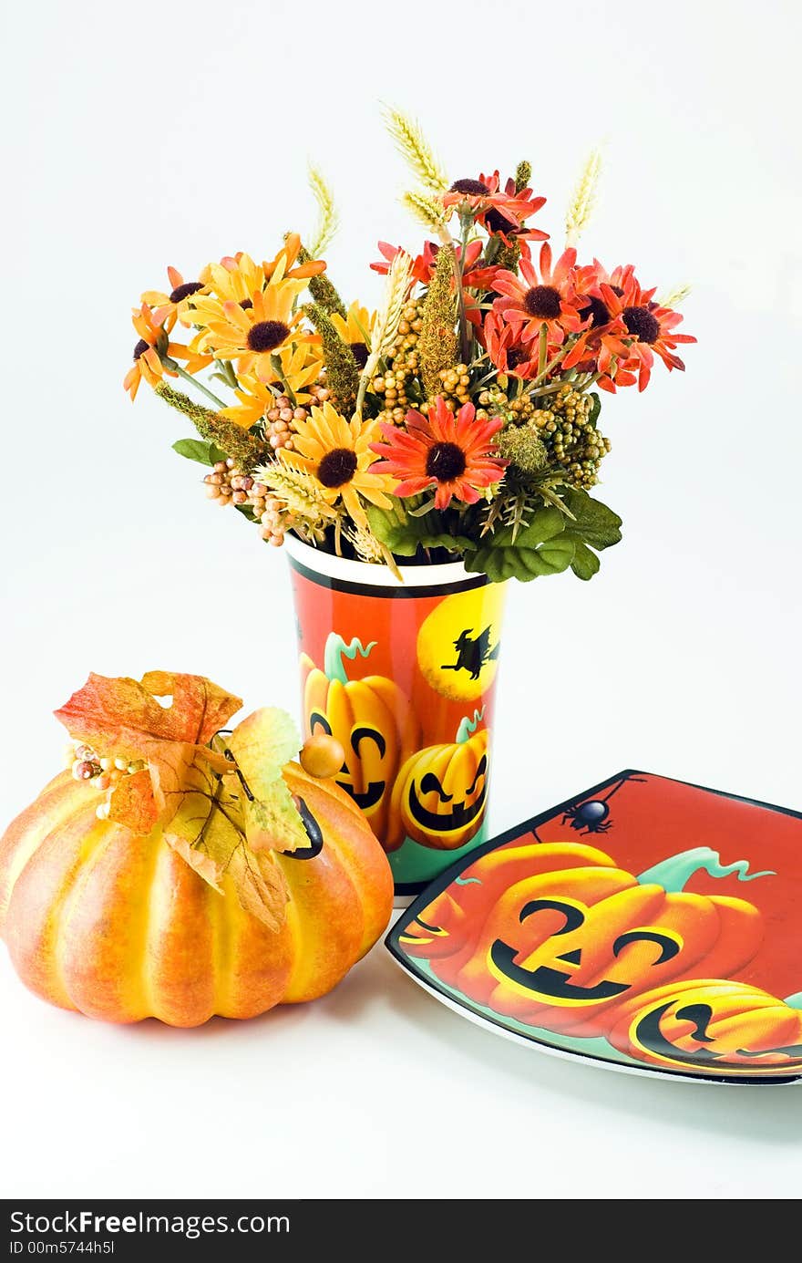 Hallowwen Flowers with a pumpkin and hallowween style plate