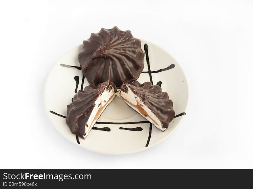 Zephyr in chocolate on white plate