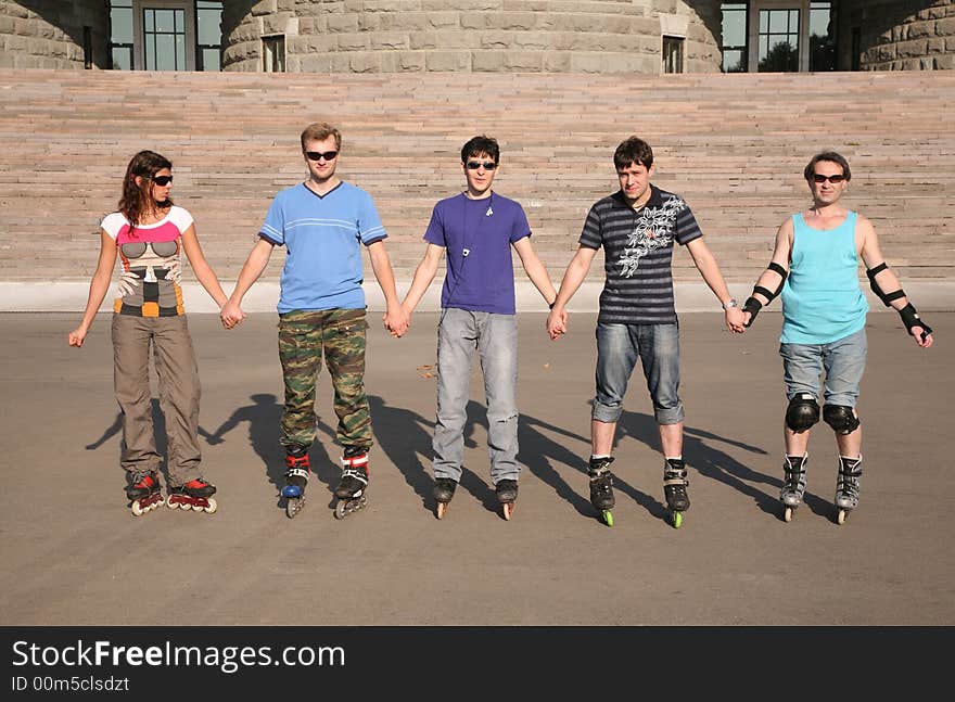 Group of people in rollers skates. Group of people in rollers skates