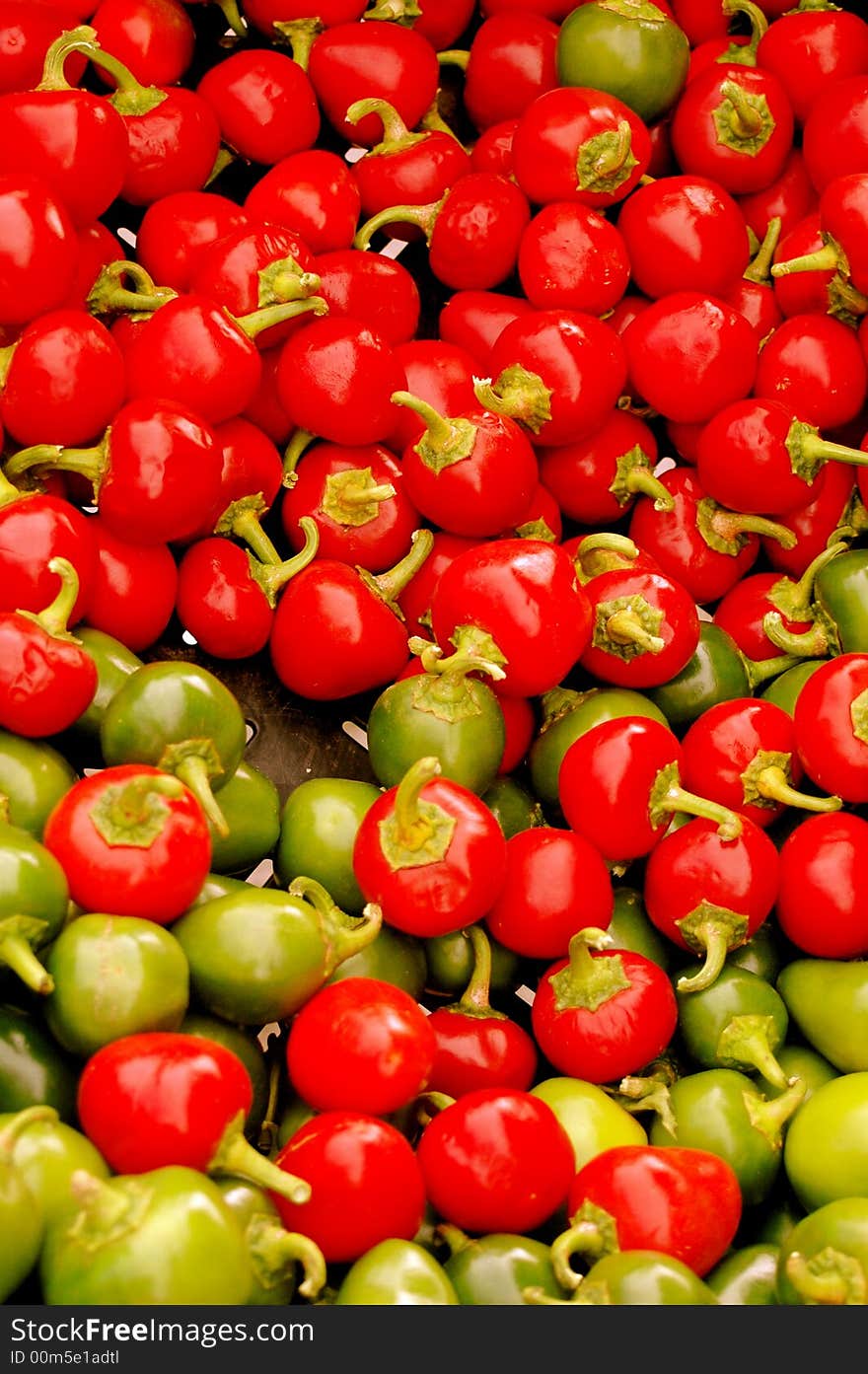 Colorful red and green peppers at a farmer's market