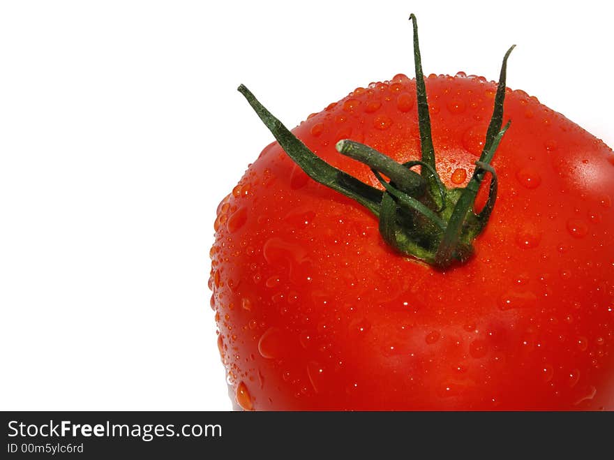 Washed red tomato on white