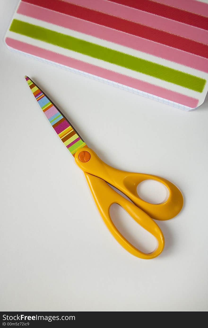 Scissors and copybook