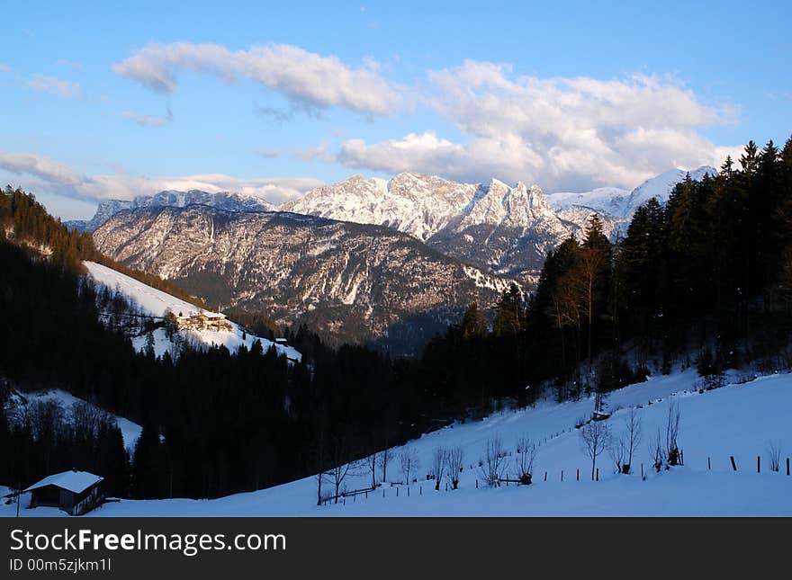 Clouds , Snow and Mountains. Alps, Austria not so far from Salzburg . White clouds on the background of blue sky .