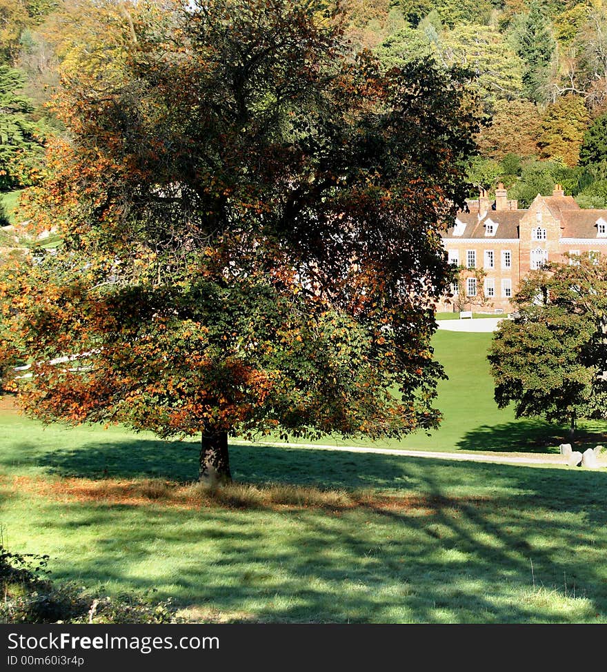 An English Autumn Landscape with the sun shining on an Historic House. An English Autumn Landscape with the sun shining on an Historic House