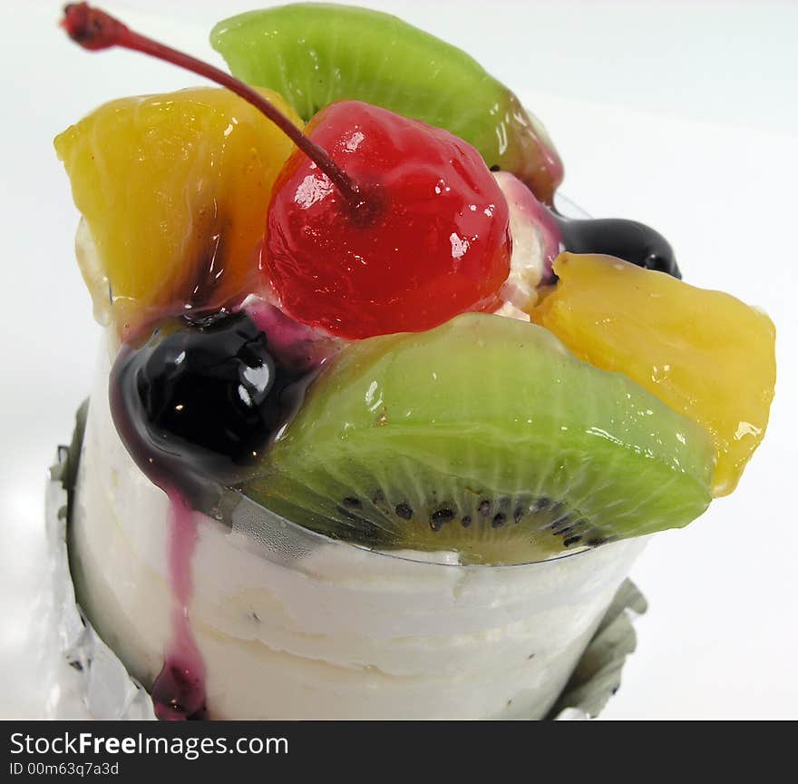 Mixed fruit topping on a small cake