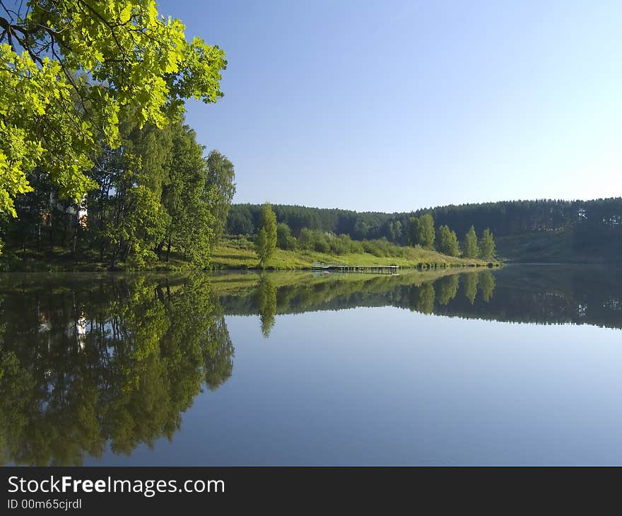 Early morning on coast of small lake. Early morning on coast of small lake