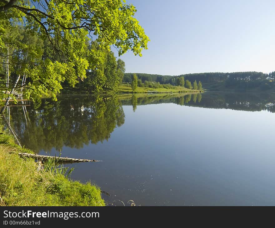 Early morning on coast of small lake. Early morning on coast of small lake