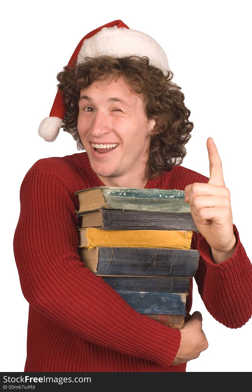 Young the man in cap Santa Claus with books on a white background. Young the man in cap Santa Claus with books on a white background