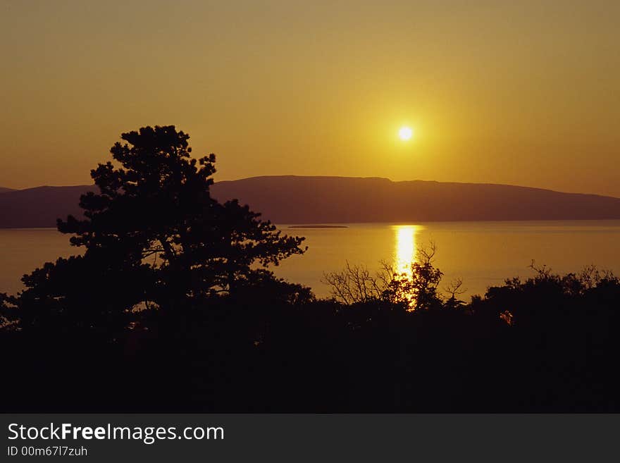 Golden sunset on sea and island