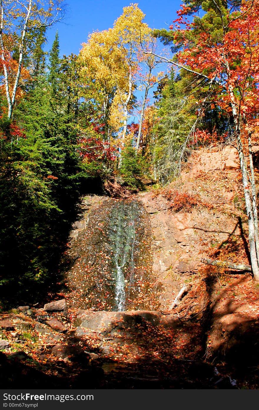 Water falls in Michigan upper peninsula during autumn time. Water falls in Michigan upper peninsula during autumn time